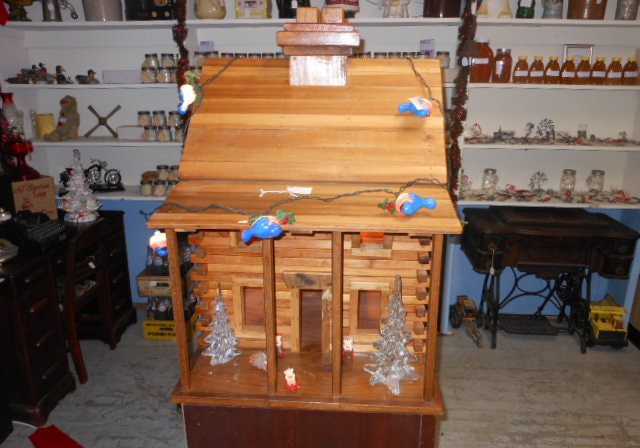 An antique oak roll top desk and other wooden furniture