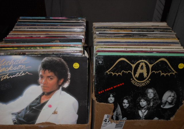 Crates of vinyl records including Michael Jackson Thriller and Aerosmith
