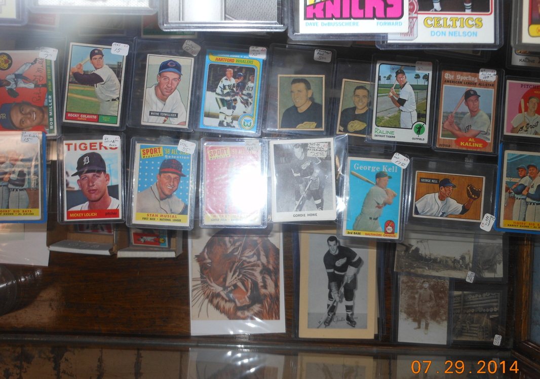Framed sports cards displayed on a wall