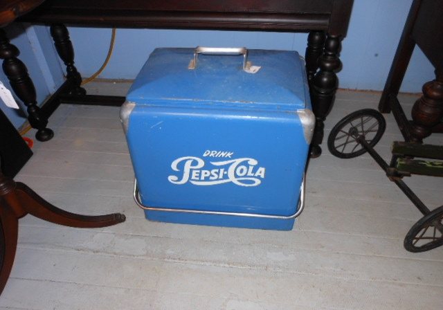 A blue Pepsi Cola metal picnic cooler