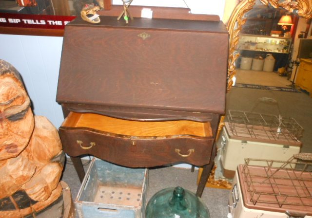 A vintage steamer trunk and leather luggage