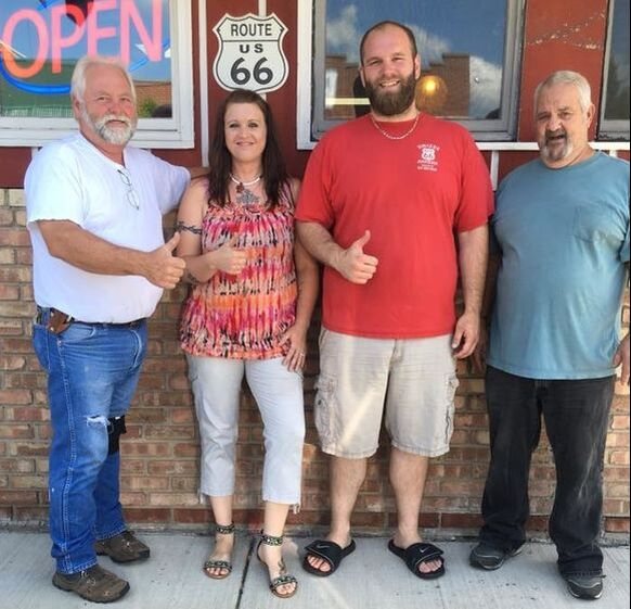 Kenny and Everett from Storage Wars Texas standing inside 66 Unique Antiques